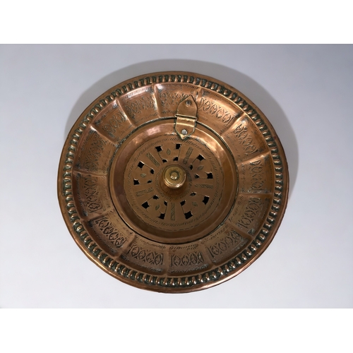 182 - A PERSIAN TINNED COPPER WASH BASIN.
18th / 19th century.
Known in Urdu as a Salfachi, with hinged li... 