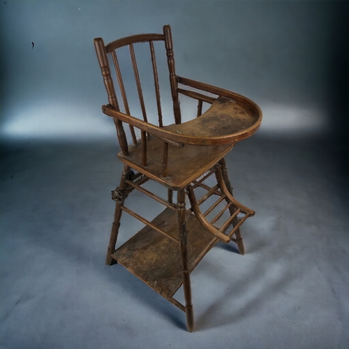 235 - A 19th Century French Childs Chair.
Folds down to walker. With original wheels.