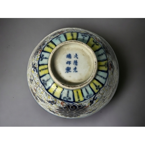 102 - A Chinese Doucai porcelain 'Lotus' bowl.
Guangxu mark and period.
Painted Lotus and scroll pattern. ... 