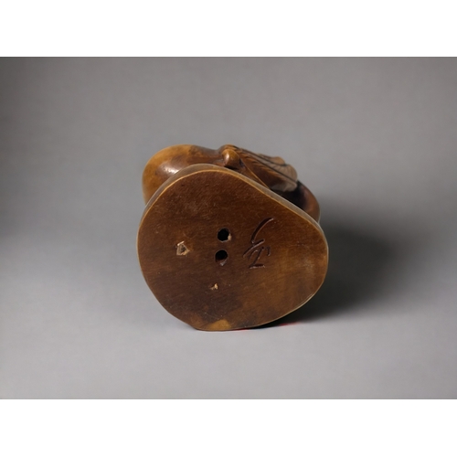 92 - Two carved Japanese Netsuke's.
20th century.
One Phoenix, signed to base. Together with a Dragon-tur... 