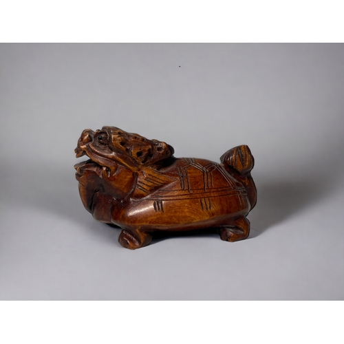 92 - Two carved Japanese Netsuke's.
20th century.
One Phoenix, signed to base. Together with a Dragon-tur... 