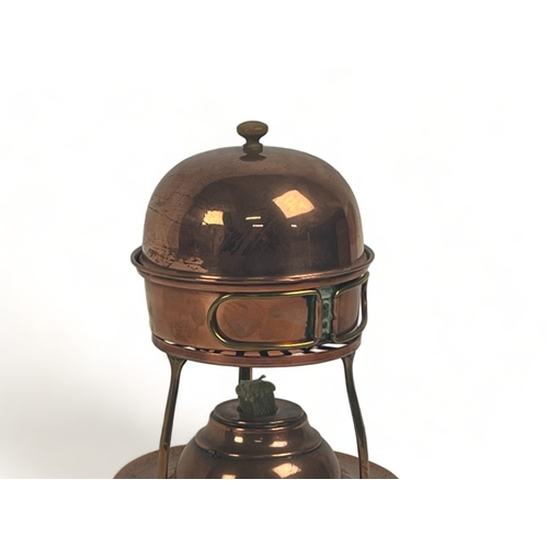 227 - An Arts & Crafts copper Egg coddler.
By W.A.S Benson, London.