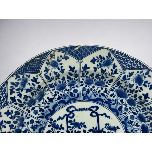 103 - A large Chinese porcelain 'Flower basket' blue & white charger Qing dynasty, Kangxi period.