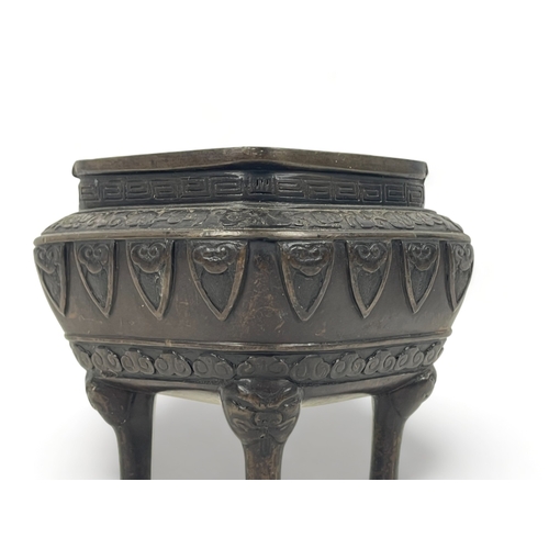 108 - A Chinese bronze censer.
Qing dynasty.
raised on fourTaotie mask feet, with stylised motifs below fo... 