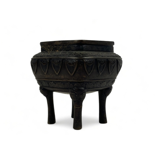 108 - A Chinese bronze censer.
Qing dynasty.
raised on fourTaotie mask feet, with stylised motifs below fo... 