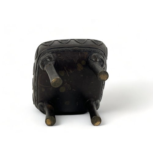 108 - A Chinese bronze censer.
Qing dynasty.
raised on fourTaotie mask feet, with stylised motifs below fo... 