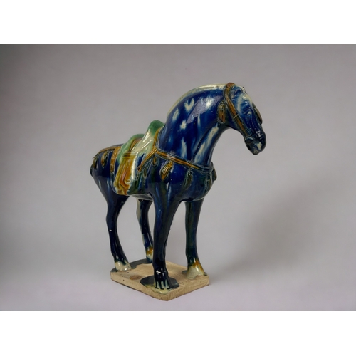 105 - A Chinese 'Tang' style horse. 
Polychrome drip glaze. Marked to base. 
Height - 22cm