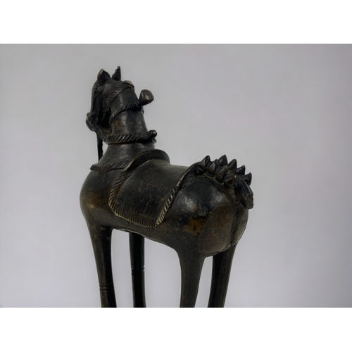 183 - A bronze Horse figure.
India, 19th century.
Height - 23cm