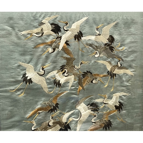 115 - A fine quality Japanese school Silk tapestry panel.
Meiji period.
Depicting numerous Cranes, on blue... 