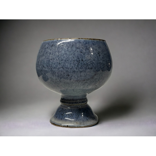 133 - A Chinese Jun type glaze lidded jar.
Moon jar form on raised foot, with mottled blue glaze.
Height -... 