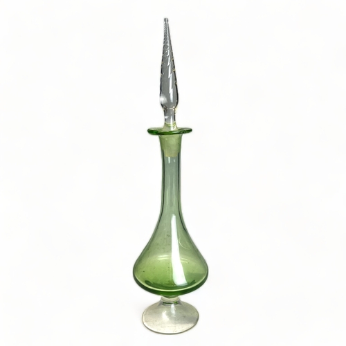 384 - A 1960's glass green horvipint by Sirkku Kumela. Together with a Blenko style green vase & stopper.