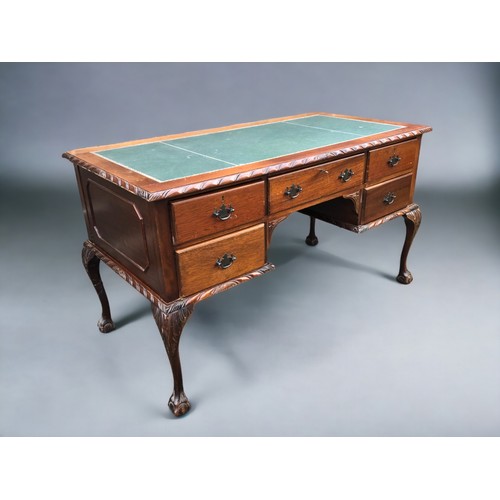 258 - A 20th Century Mahogany Desk, with dragoon edging, cabriole legs with ball and claw feet. Green leat... 