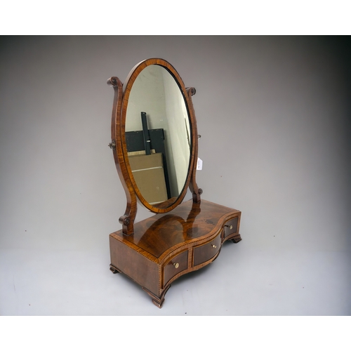 260 - A George III Mahogany & Kingwood crossbanded toilet mirror.
Serpentine base, fitted with three drawe... 