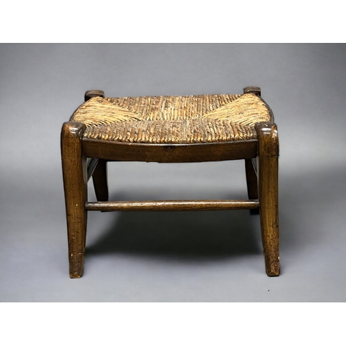 288 - A pair of 19th century provincial fruitwood footstools.
On sabre legs linked by stretchers, with wov... 