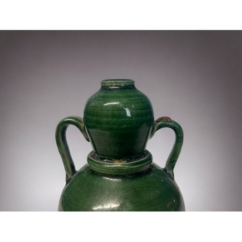 128 - A Chinese green glazed twin hand gourd vase. 
Height - 15cm