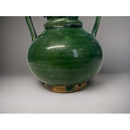 128 - A Chinese green glazed twin hand gourd vase. 
Height - 15cm