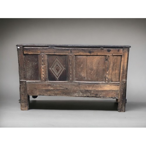 289 - AN early 18th century Oak side cupboard.
Plank top above four drawers and arched door. On bracket fe... 