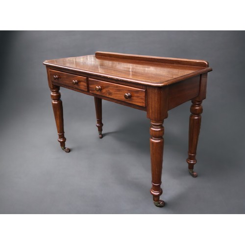 294 - A Victorian Maple & Co Mahogany writing table.
Having 2 drawers. The Right hand drawer stamped Maple... 