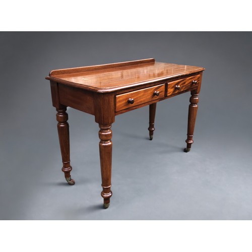 294 - A Victorian Maple & Co Mahogany writing table.
Having 2 drawers. The Right hand drawer stamped Maple... 