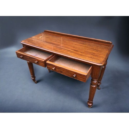 294 - A Victorian Maple & Co Mahogany writing table.
Having 2 drawers. The Right hand drawer stamped Maple... 