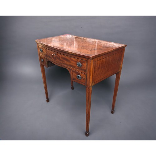 295 - A 19th Century Sheraton Style Flame Mahogany Ladies writing desk. 1 over 2 drawers supported on slen... 