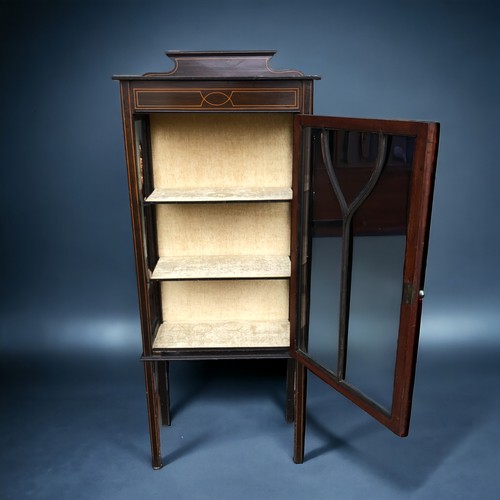 297 - An Edwardian Glazed Display Cabinet.
Stood on slender legs with key and fitted interior.
Height 146c... 