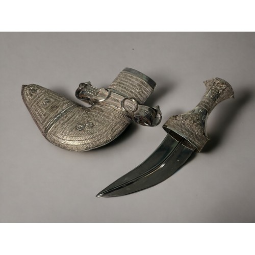 184 - A Omani Jambiya Dagger.
With silver embossed and filigree design.
20th century.