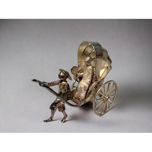 138 - A Chinese export silver miniature rickshaw & driver.
Wang Hing & co, late 19th / early 20th century.... 