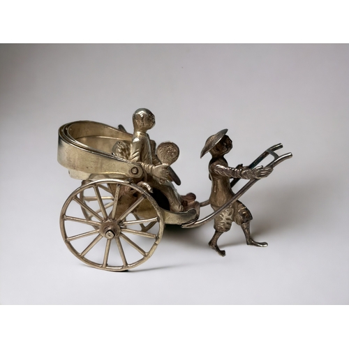 138 - A Chinese export silver miniature rickshaw & driver.
Wang Hing & co, late 19th / early 20th century.... 