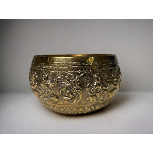 187 - A Burmese embossed Thabiek bowl, together with two white metal containers.