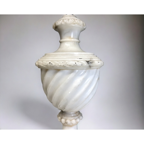 330 - A pair of vintage Italian carved Alabaster table lamps. 
Spiral baluster body on stepped base.
One s... 