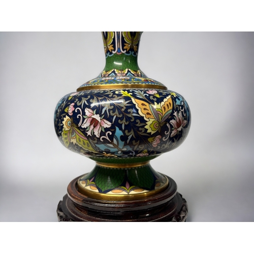 143 - A pair of good quality Chinese cloisonne vases.
Finely detailed with various Butterflies & foliate d... 