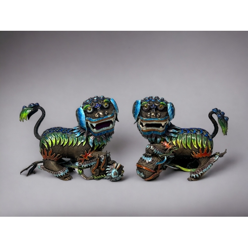 145 - A pair of Chinese silver filigree & enamel 'Guardian Lions'. Early-Mid 20th century. Silver fili... 