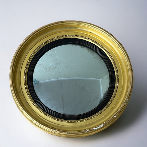 334 - A George III round Gilt frame wall mirror. English, 19th Century.  Approx diameter 58cms