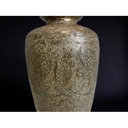 190 - AN INDIAN CHISELLED BRASS VASE. 
HEIGHT - 30CM