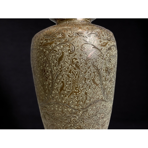 190 - AN INDIAN CHISELLED BRASS VASE. 
HEIGHT - 30CM