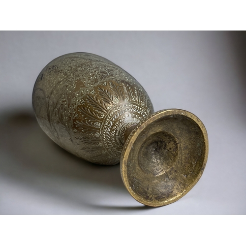 190 - AN INDIAN CHISELLED BRASS VASE. 
HEIGHT - 30CM