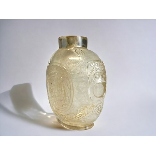 156A - A Chinese carved Rock crystal snuff bottle. Qing dynasty, 19th century. Skilfully carved roundels on... 