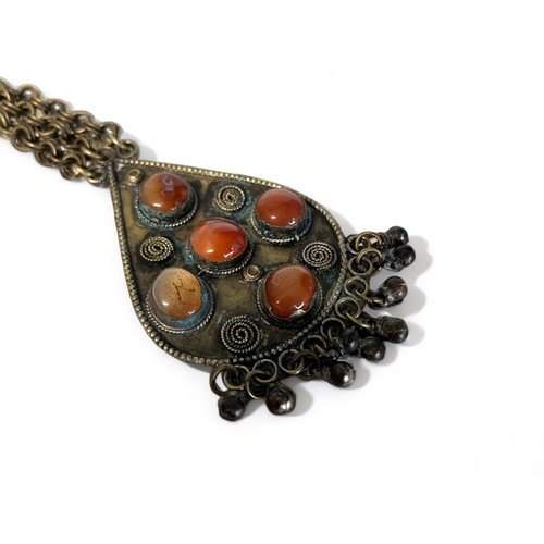 85 - A LARGE TIBETAN HAND MADE NECKLACE.
Metal, inlaid with large polished cabochon stones.