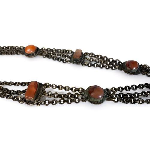 85 - A LARGE TIBETAN HAND MADE NECKLACE.
Metal, inlaid with large polished cabochon stones.