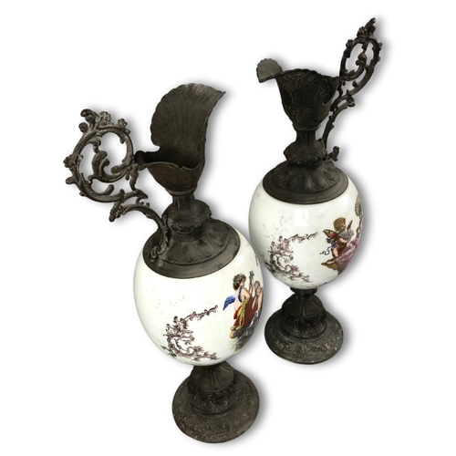 52 - A Large pair of Wavecrest Opaline Glass and metal Ewers. Depicting scenes of Cherubs.