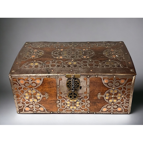 723 - A SPANISH METAL BOUND TRUNK / BOX.
Circa 1900.
Bound with stylised motifs inset with polished brass ... 