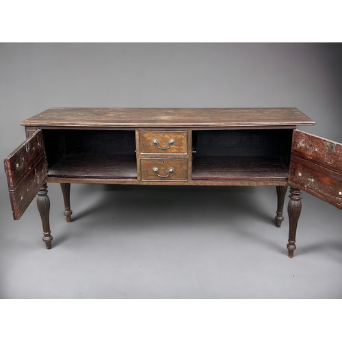 114 - A George III long Oak dresser base. With planked top and reeded legs. Two central drawers pair with ... 