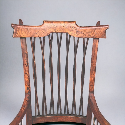 115 - A Victorian Faux Rosewood rocking armchair.
With unusual twist stick back & sides.