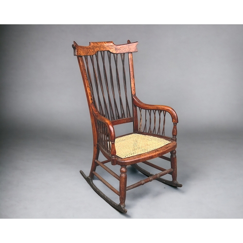 115 - A Victorian Faux Rosewood rocking armchair.
With unusual twist stick back & sides.