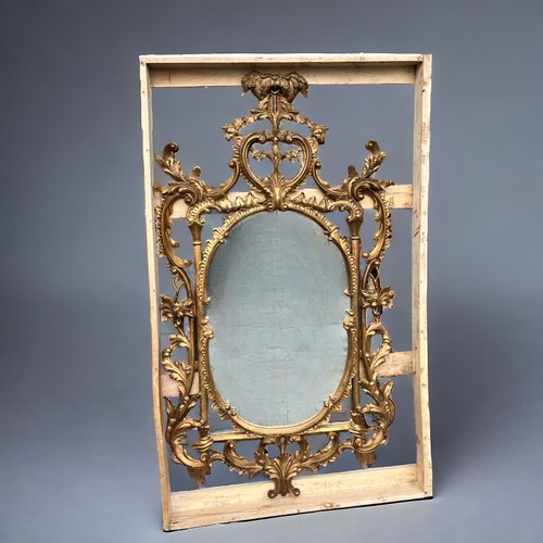 121 - A Large Italian, hand carved Gilt Wood Rococo Mirror. In the venetian style. Scrolling foliate motif... 