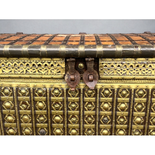 123 - A very large Syrian palace chest.Late 19th / early 20th century.Solid Walnut, mounted with hand beat... 