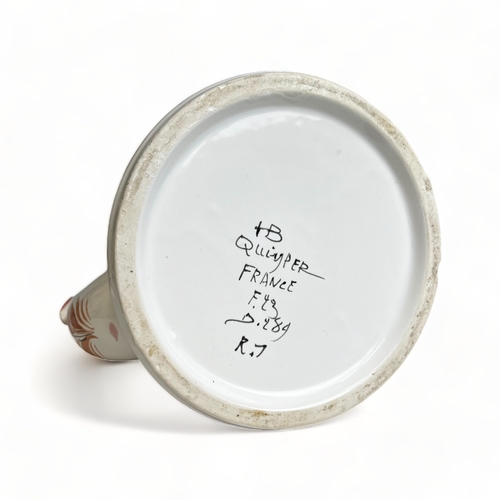 66 - A collection of hand painted Art pottery. Including a Quimper teapot, British Roskyl pottery jug and... 