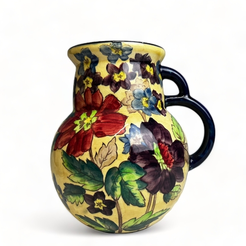 66 - A collection of hand painted Art pottery. Including a Quimper teapot, British Roskyl pottery jug and... 