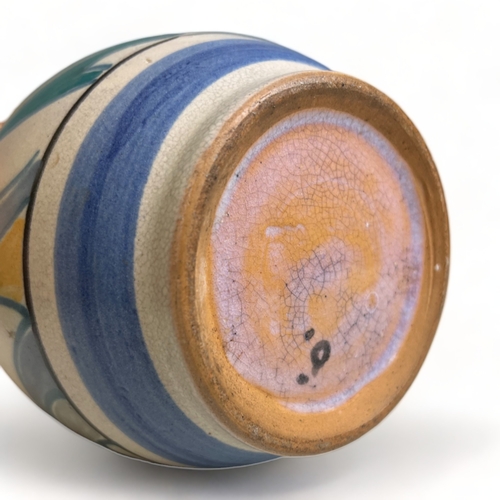 66 - A collection of hand painted Art pottery. Including a Quimper teapot, British Roskyl pottery jug and... 